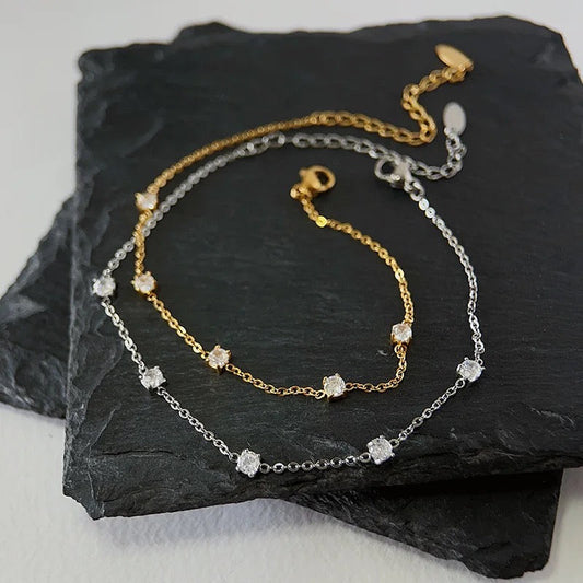 Stålarmband med 18K förgyllning och CZ 16+3 cm