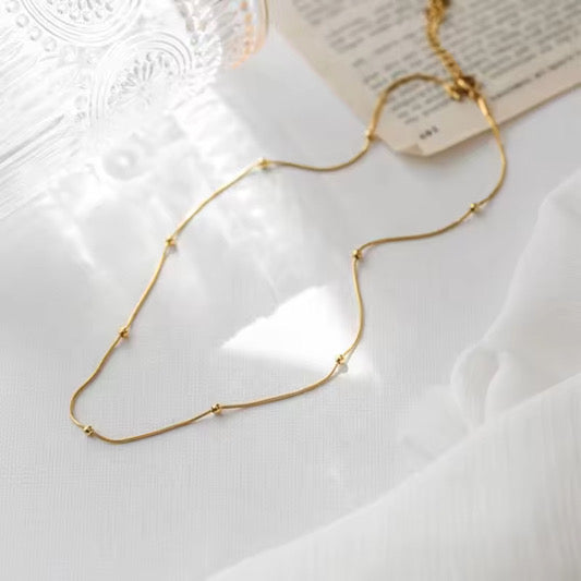 Stålhalsband med 18K förgyllning 40+6 cm