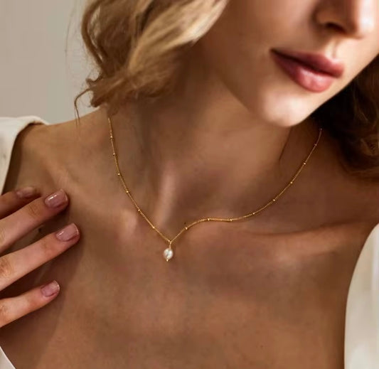 Stålhalsband med 18K förgyllning och Sötvattenpärla 40+5 cm