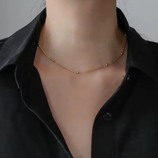 Stålhalsband med 18K förgyllning 40+6 cm